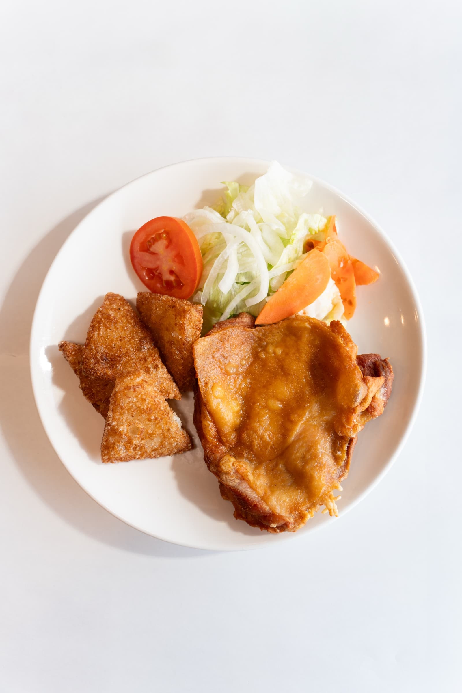 Gà Roti, fried chicken in the chef's special sauce, with salad